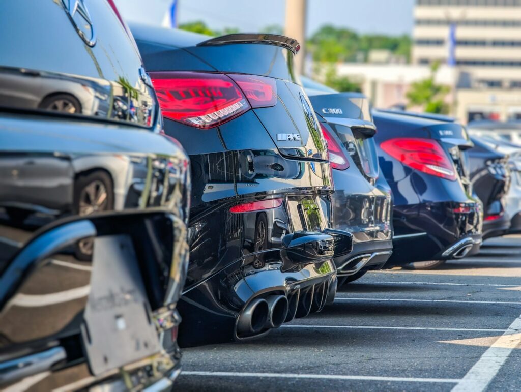 a row of parked cars in a parking lot